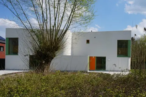 Newly built house with garden bordering nature reserve.